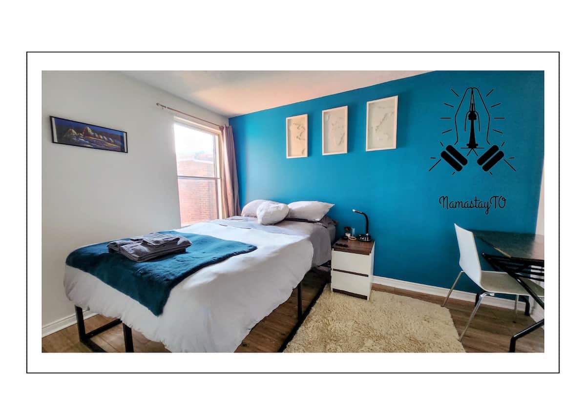 The South Room — queen bed with backyard view